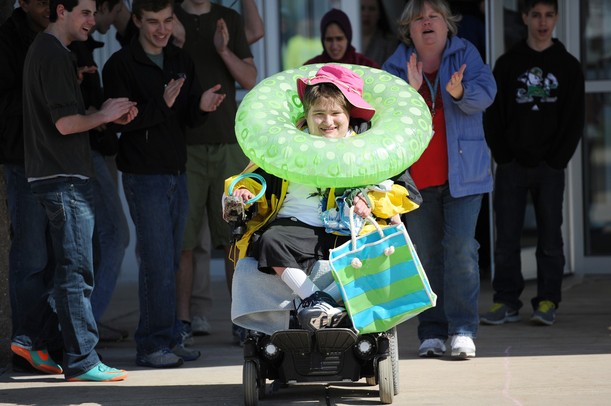 Chelsea senior Chris Germann smiles as he participates in a relay race while loaded up with beach attire during a field day for Washtenaw County Special Olympic athletes at Fr. Gabriel Richard on Wednesday, April 17, 2013. Melanie Maxwell I AnnArbor.com